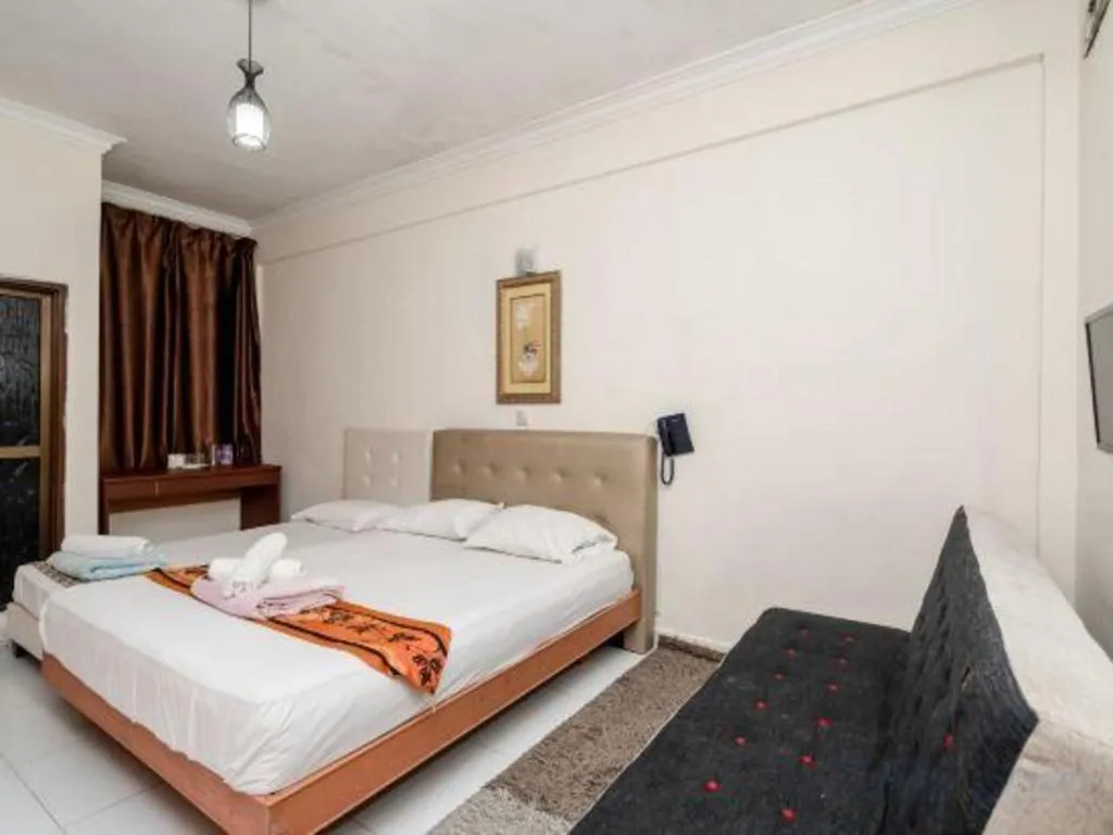 Bed in Lai Ming Hotel Cosmoland