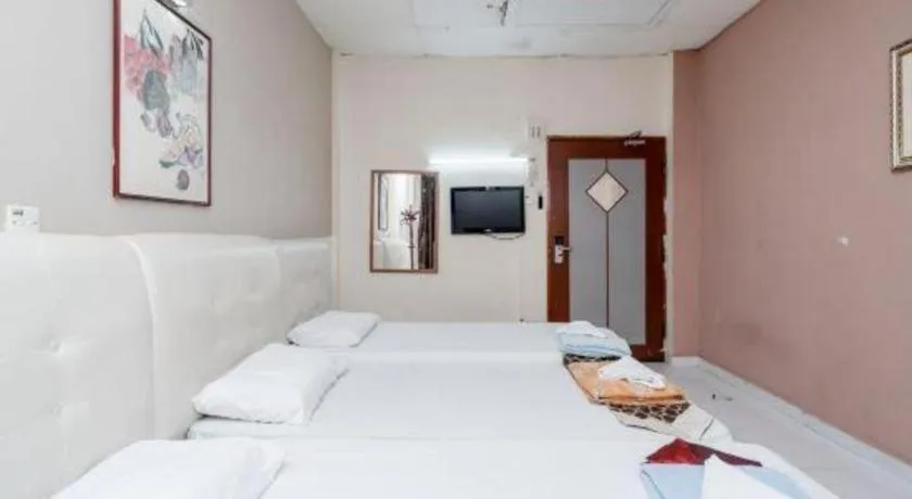 Bed in Lai Ming Hotel Cosmoland