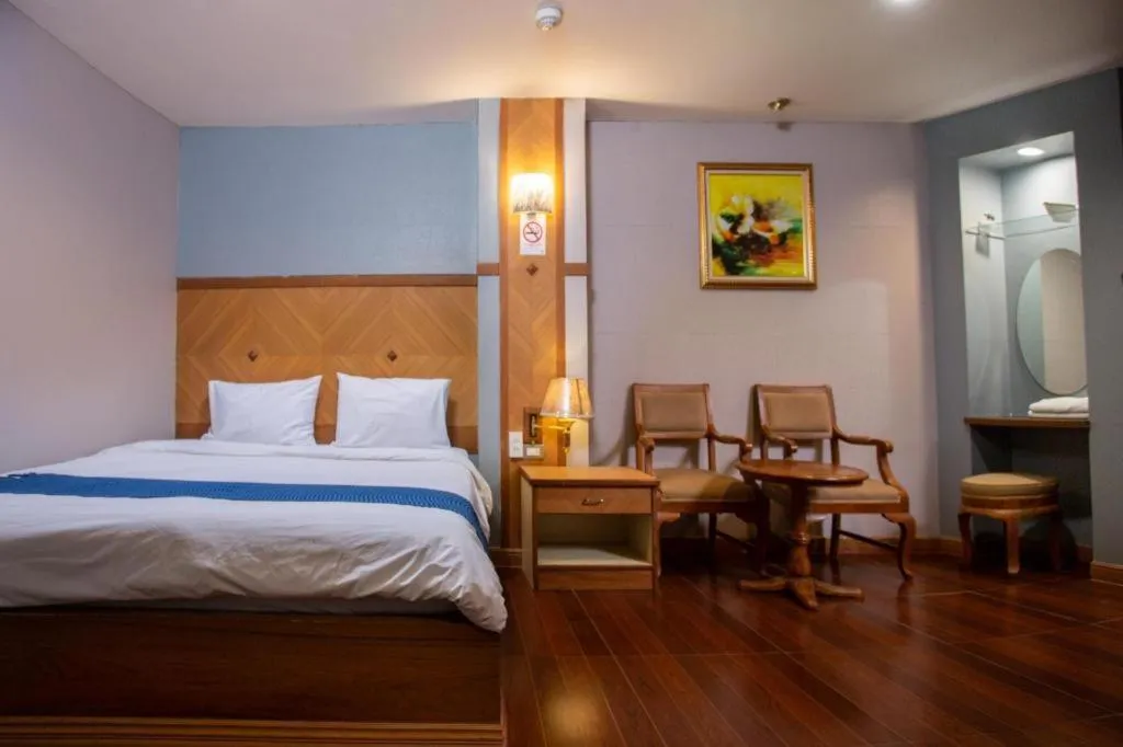 Bed in NH Elegant Hotel