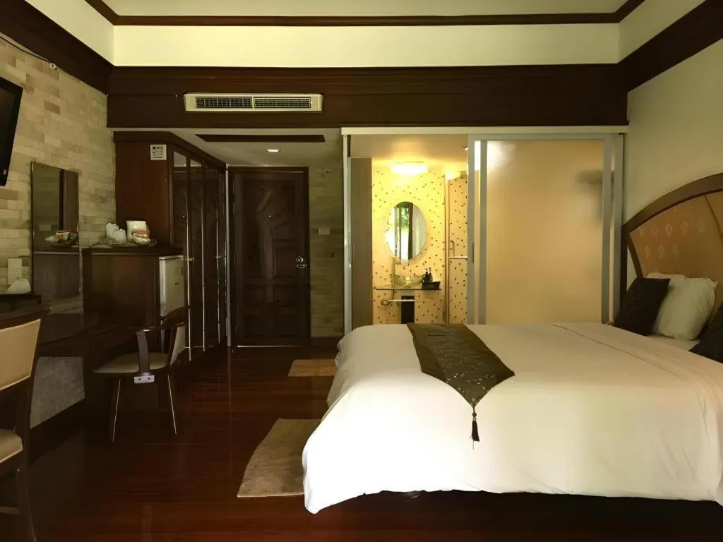 Bed in NH Elegant Hotel