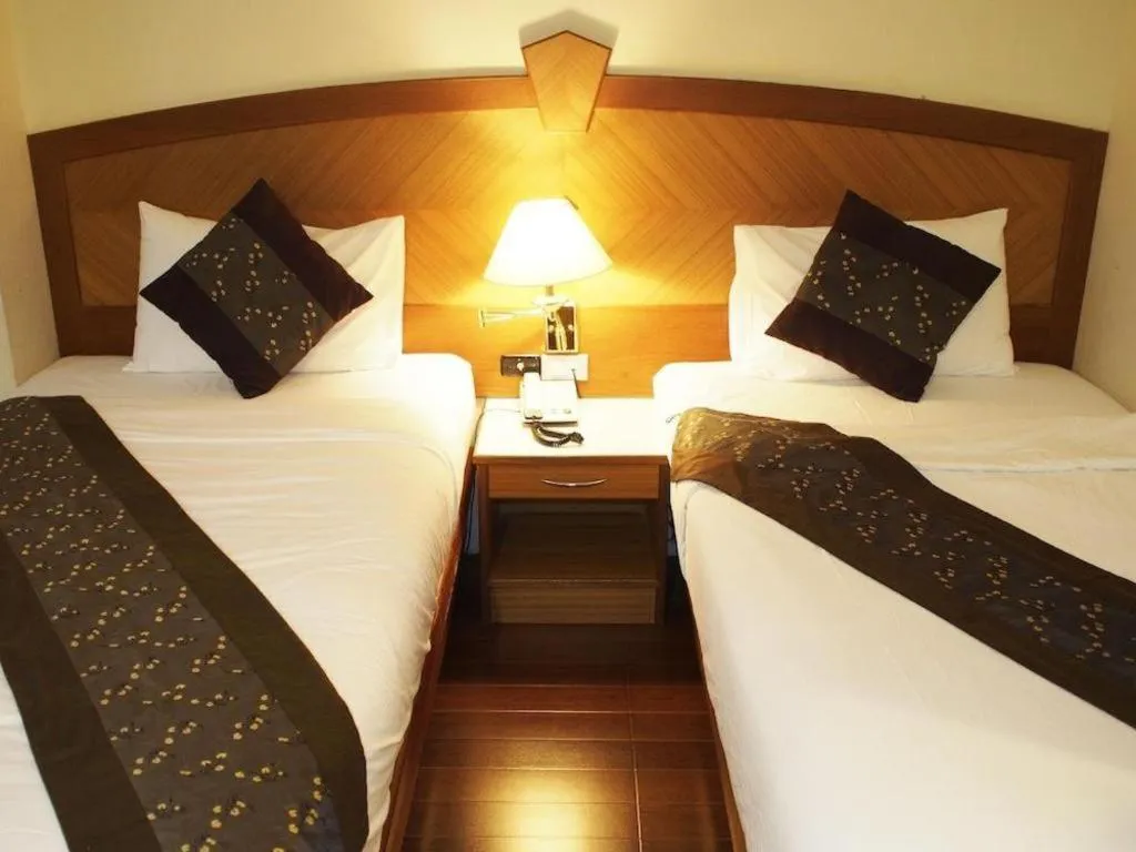 Bed in NH Elegant Hotel