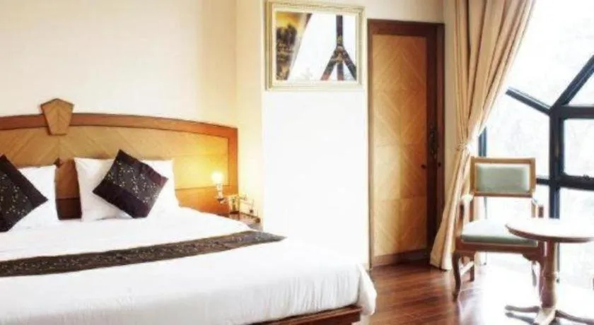 Bed in NH Elegant Hotel