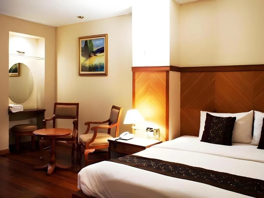 Bed in NH Elegant Hotel