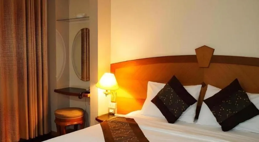 Bed in NH Elegant Hotel