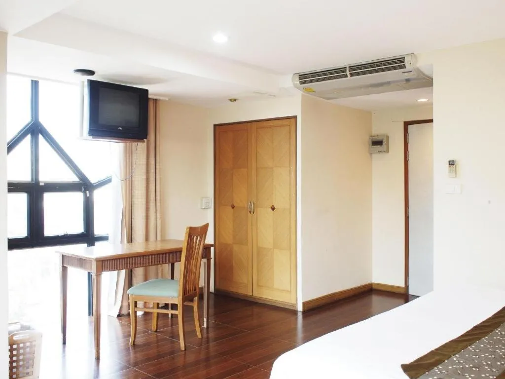 Bed in NH Elegant Hotel