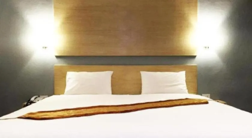 Bed in NH Elegant Hotel