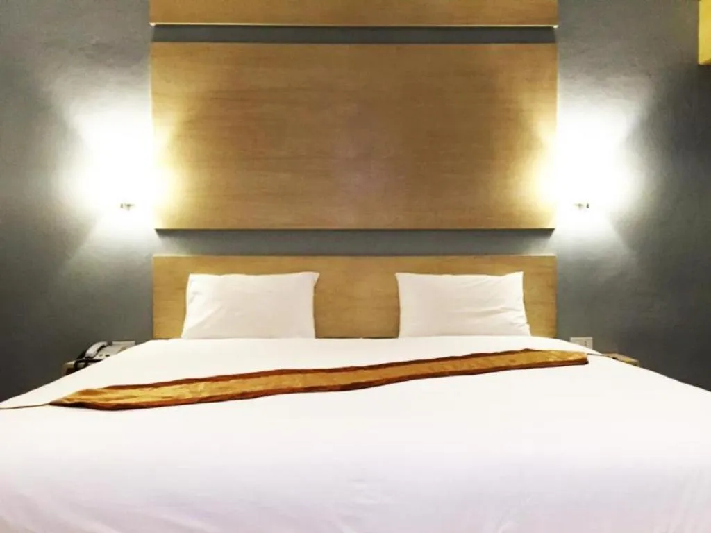 Bed in NH Elegant Hotel