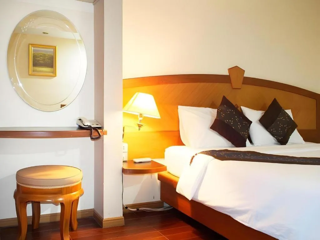 Bed in NH Elegant Hotel