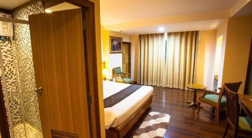 Bed in NH Elegant Hotel