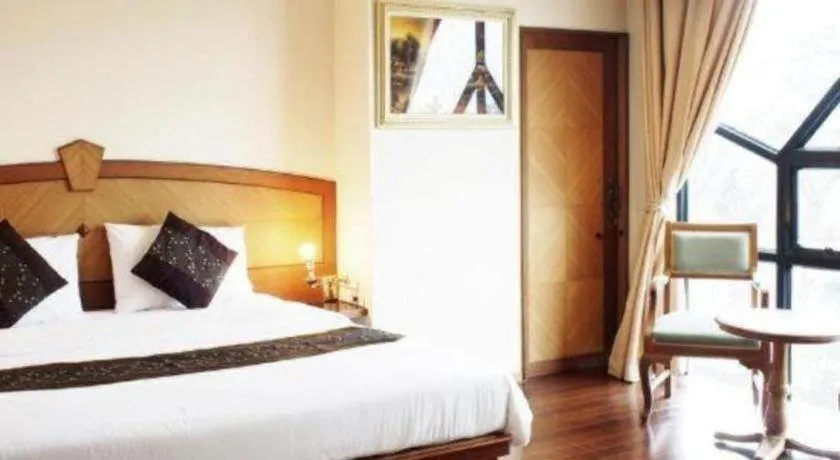 Bed in NH Elegant Hotel