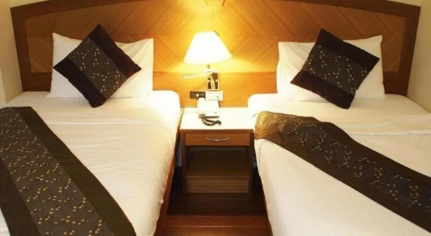 Bed in NH Elegant Hotel