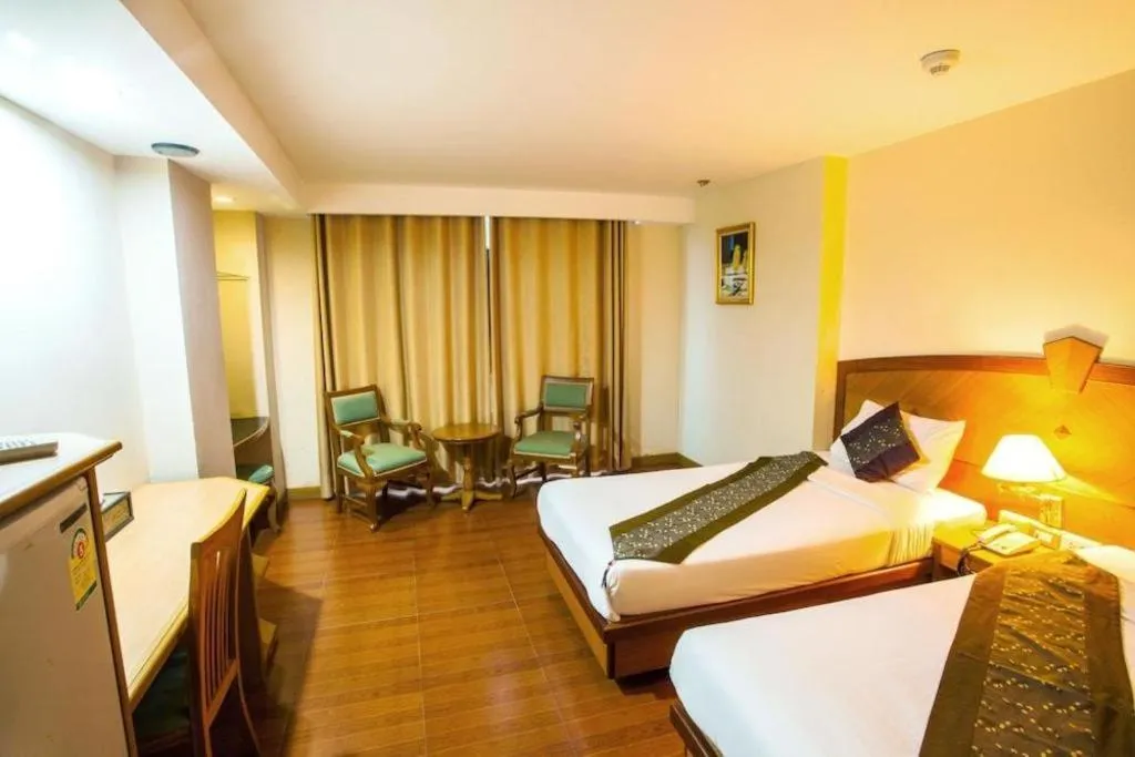 Bed in NH Elegant Hotel