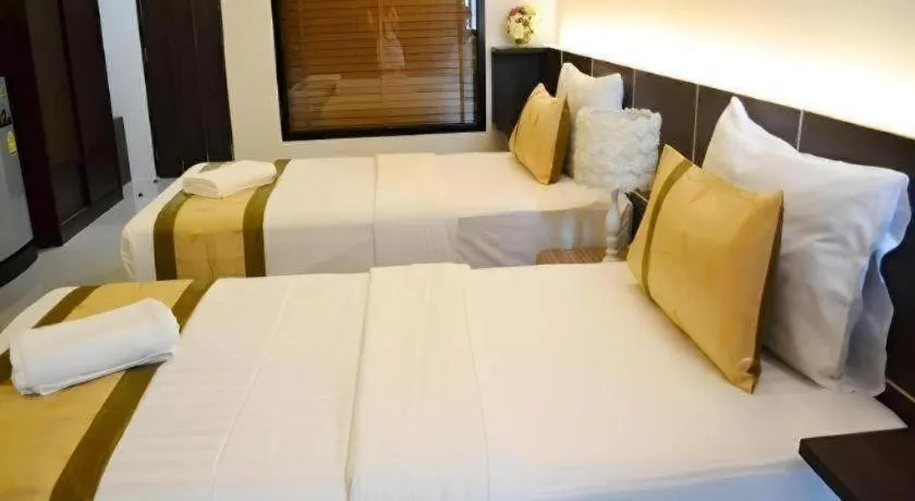 Bed in The Convenience Hotel