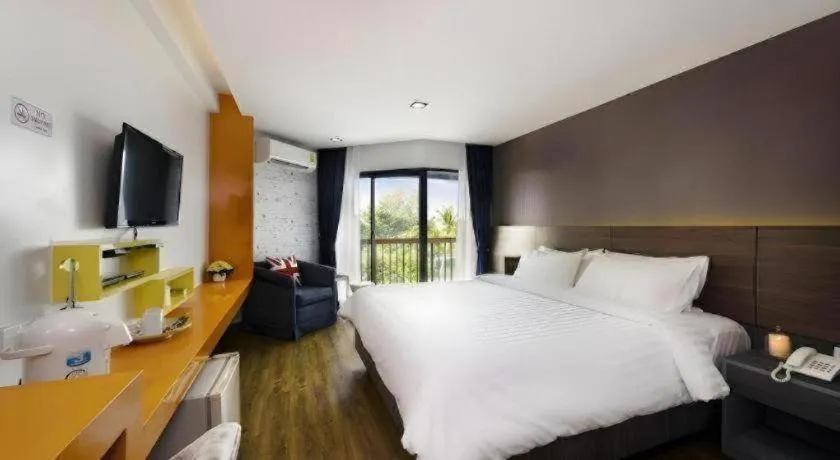 Bed in The Loft Seaside Sriracha Hotel