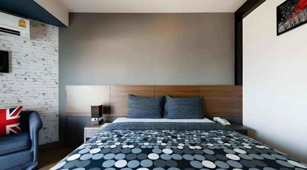 Bed in The Loft Seaside Sriracha Hotel