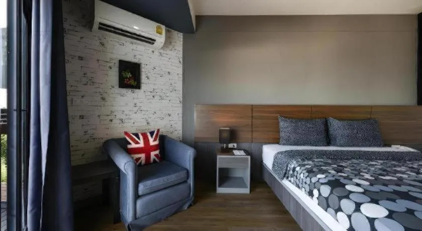 Bed in The Loft Seaside Sriracha Hotel