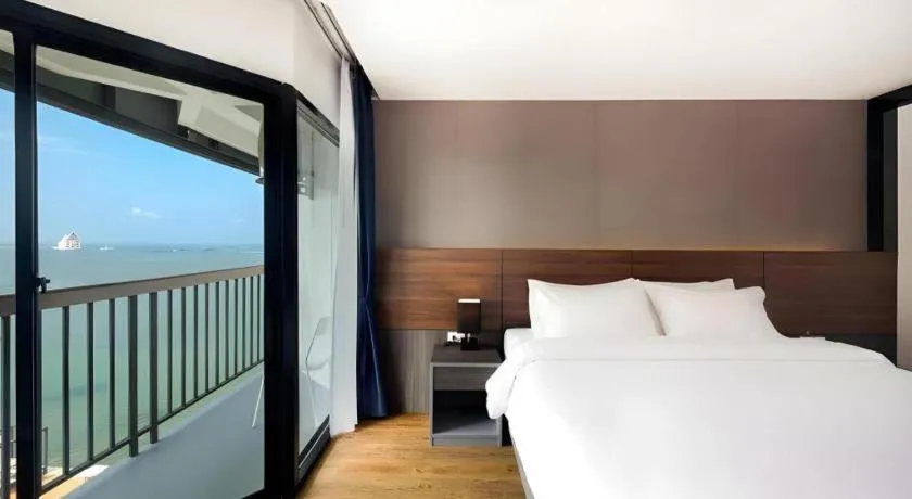 Bed in The Loft Seaside Sriracha Hotel