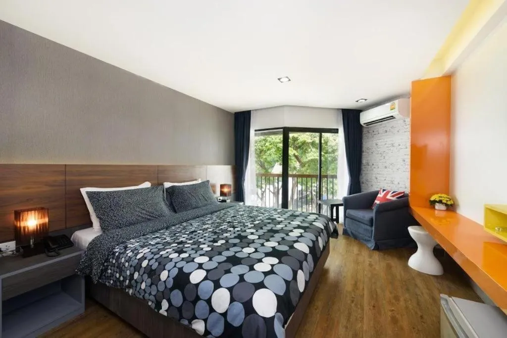 Bed in The Loft Seaside Sriracha Hotel