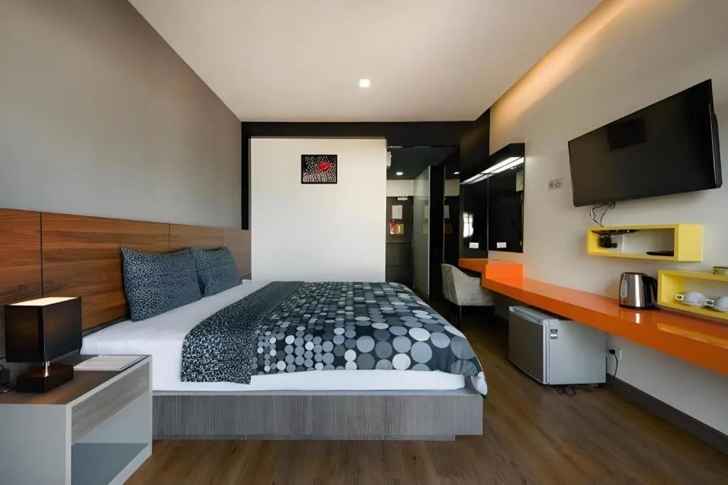 Bed in The Loft Seaside Sriracha Hotel