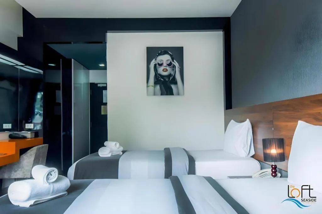 Bed in The Loft Seaside Sriracha Hotel