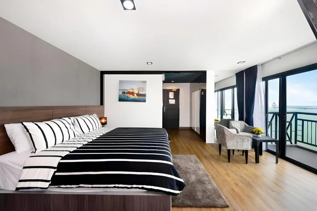 Bed in The Loft Seaside Sriracha Hotel