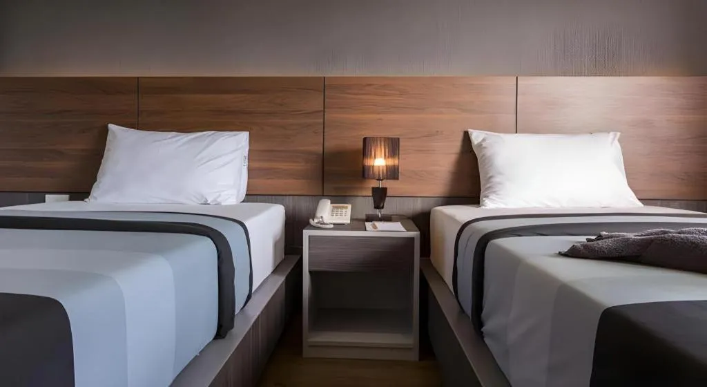 Bed in The Loft Seaside Sriracha Hotel