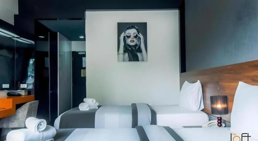 Bed in The Loft Seaside Sriracha Hotel