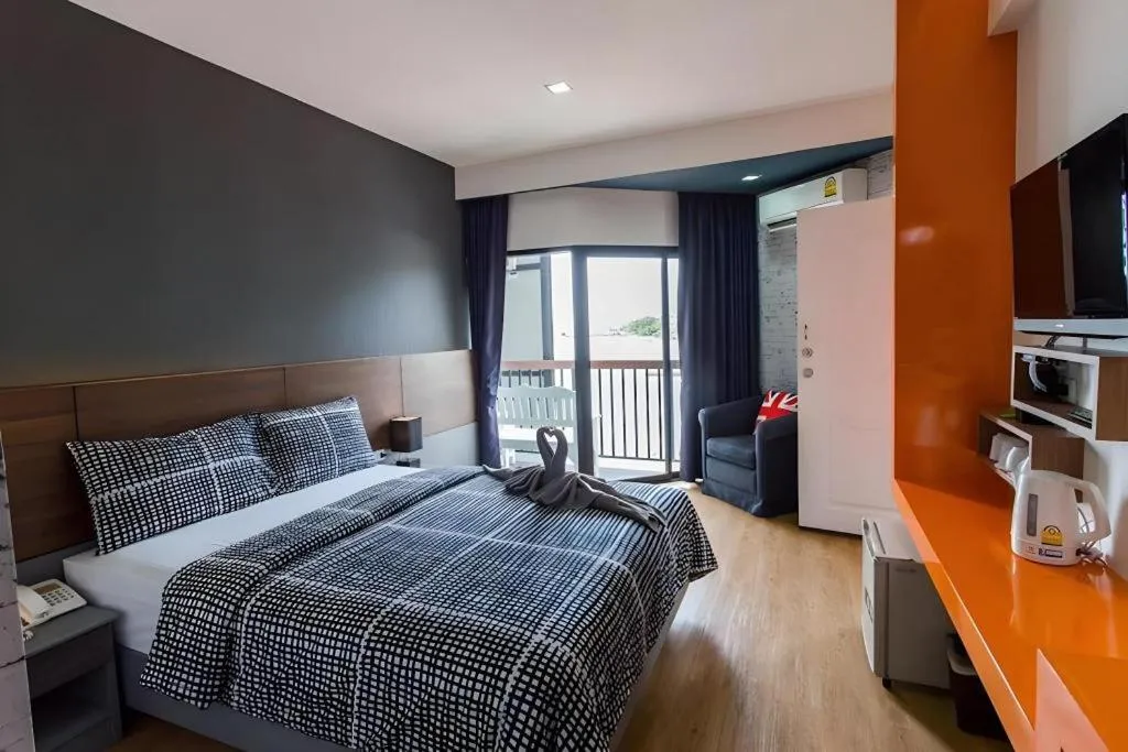 Bed in The Loft Seaside Sriracha Hotel