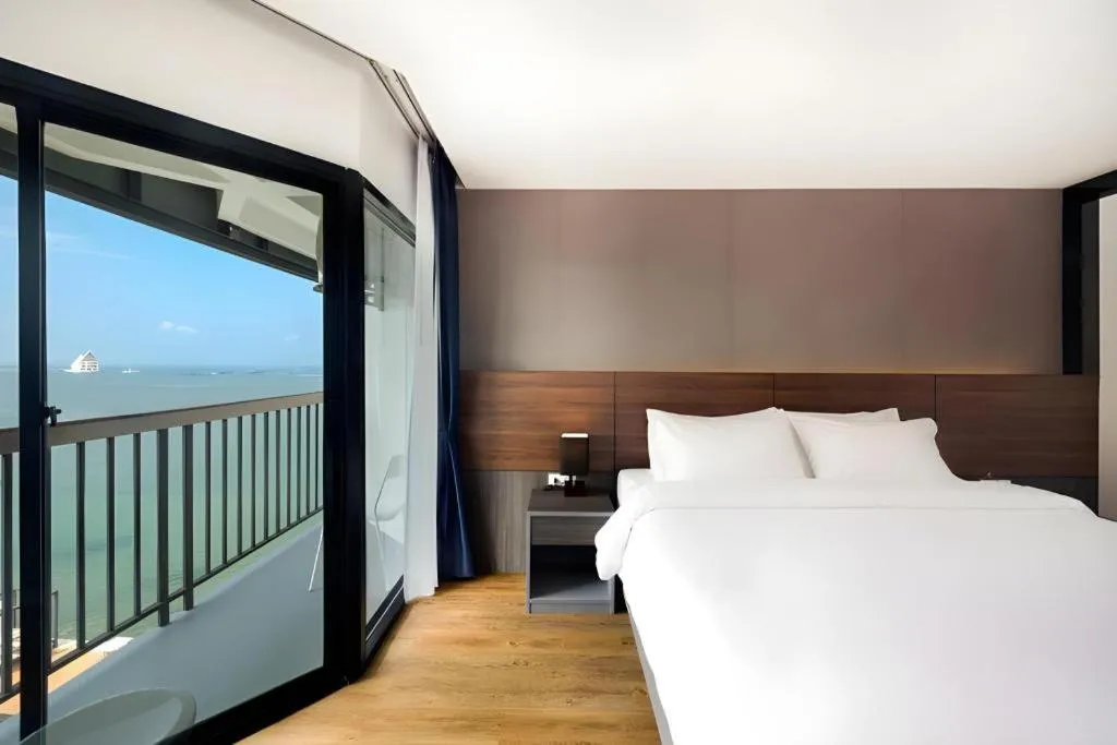 Bed in The Loft Seaside Sriracha Hotel