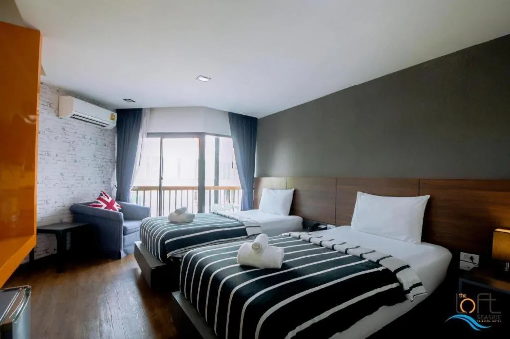 Bed in The Loft Seaside Sriracha Hotel