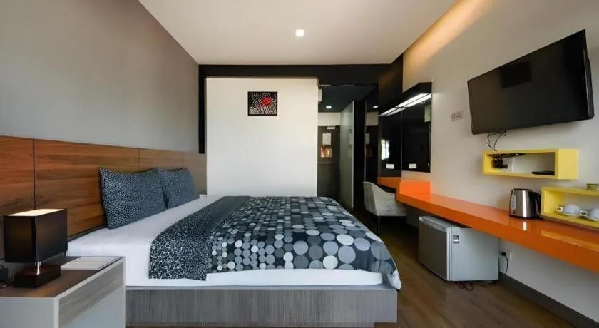 Bed in The Loft Seaside Sriracha Hotel