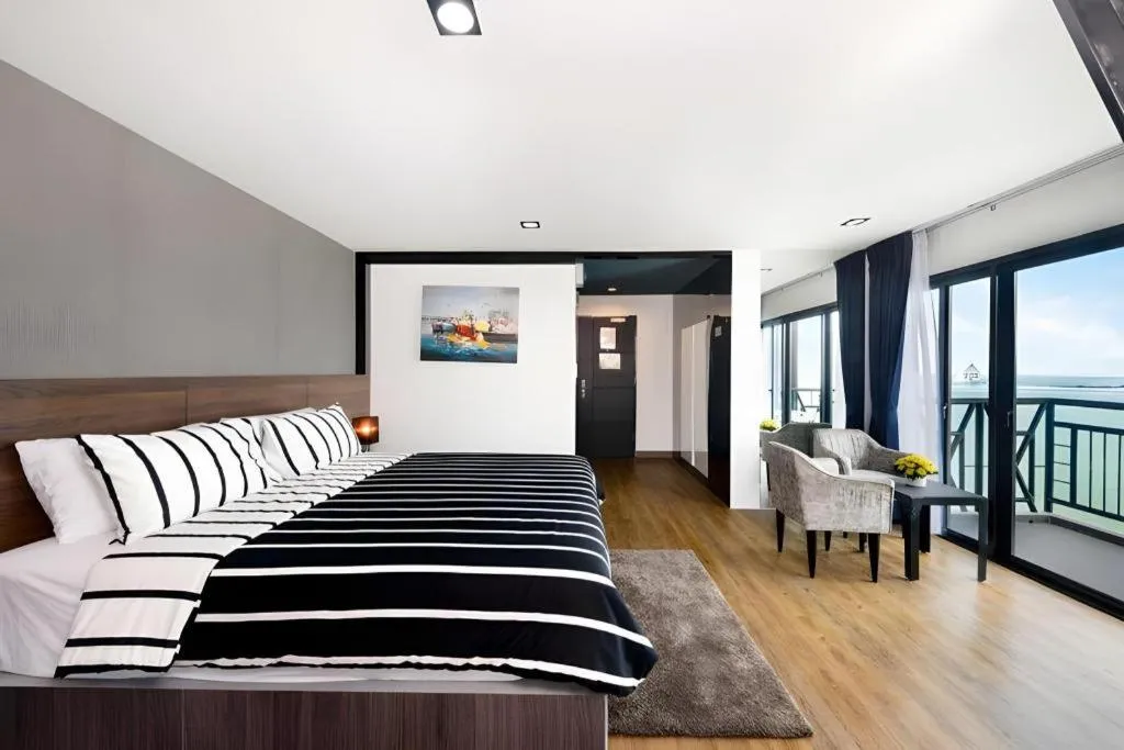 Bed in The Loft Seaside Sriracha Hotel