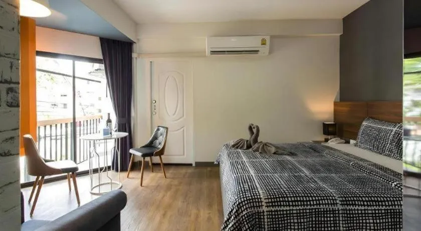 Bed in The Loft Seaside Sriracha Hotel