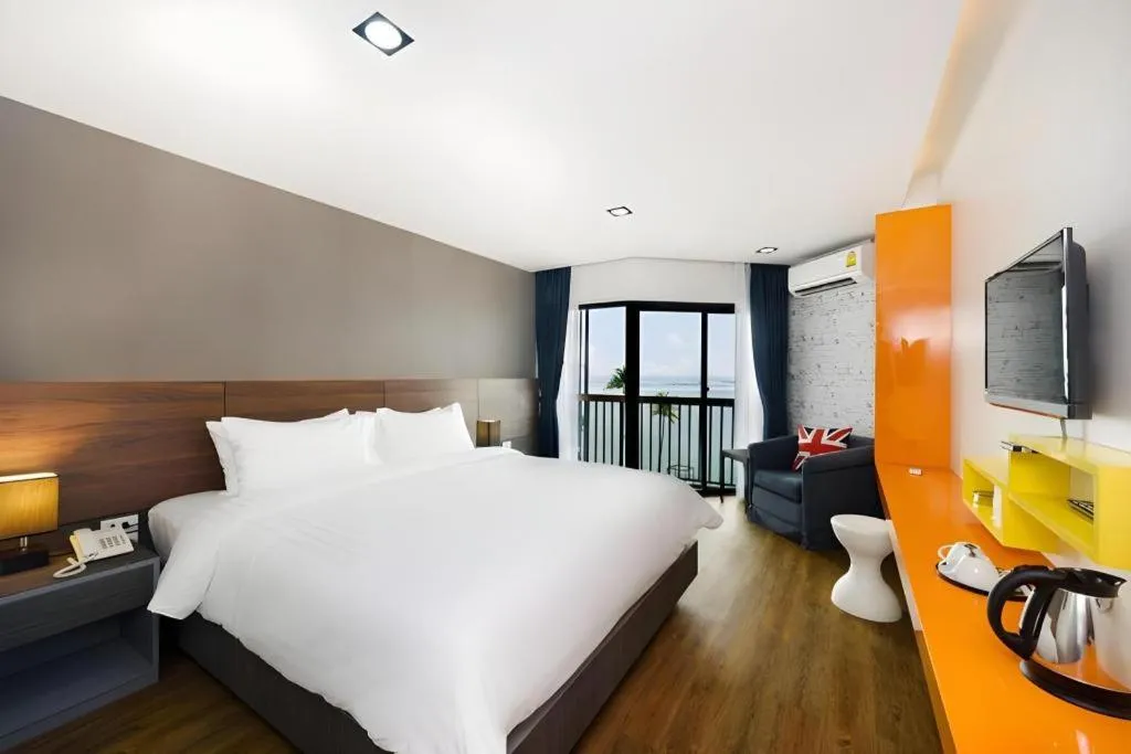 Bed in The Loft Seaside Sriracha Hotel