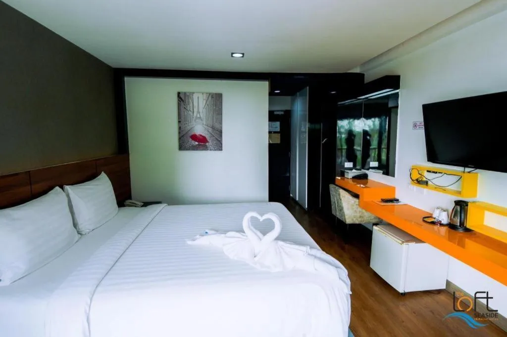 Bed in The Loft Seaside Sriracha Hotel