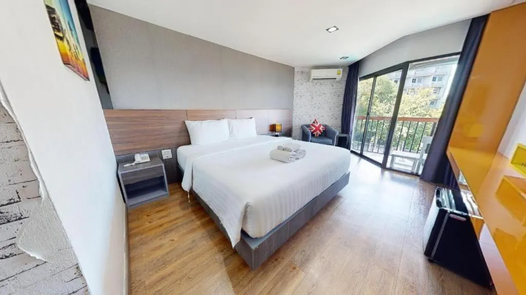 Bed in The Loft Seaside Sriracha Hotel