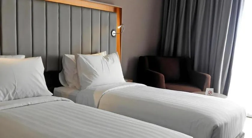 Bed in Gammara Hotel Makassar