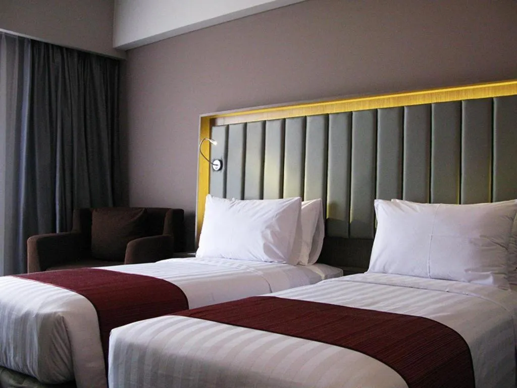 Bed in Gammara Hotel Makassar