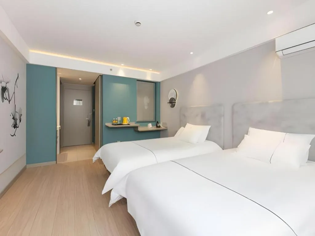 Bed in Magnotel Hotel Shanghai Jinjiang Park Branch