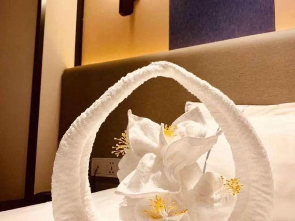 Bed in Magnotel Hotel Shanghai Jinjiang Park Branch