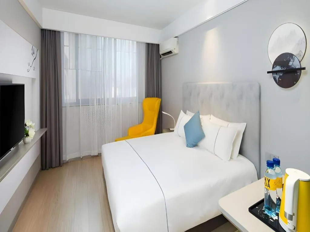 Bed in Magnotel Hotel Shanghai Jinjiang Park Branch