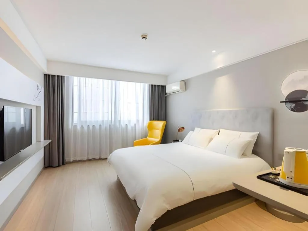 Bed in Magnotel Hotel Shanghai Jinjiang Park Branch