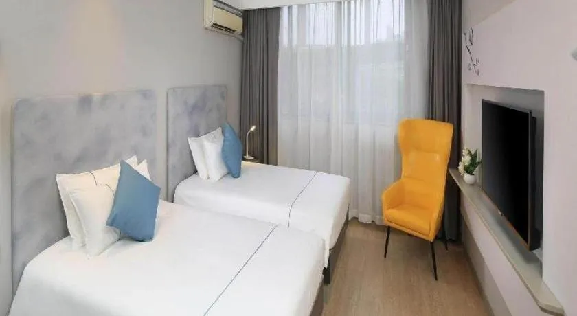 Bed in Magnotel Hotel Shanghai Jinjiang Park Branch