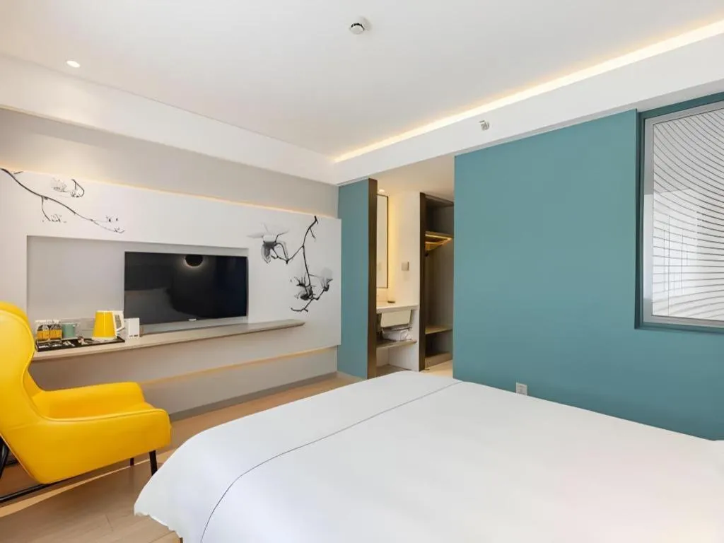 Bed in Magnotel Hotel Shanghai Jinjiang Park Branch