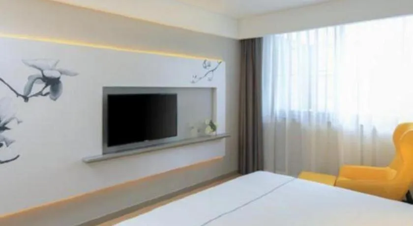 Bed in Magnotel Hotel Shanghai Jinjiang Park Branch