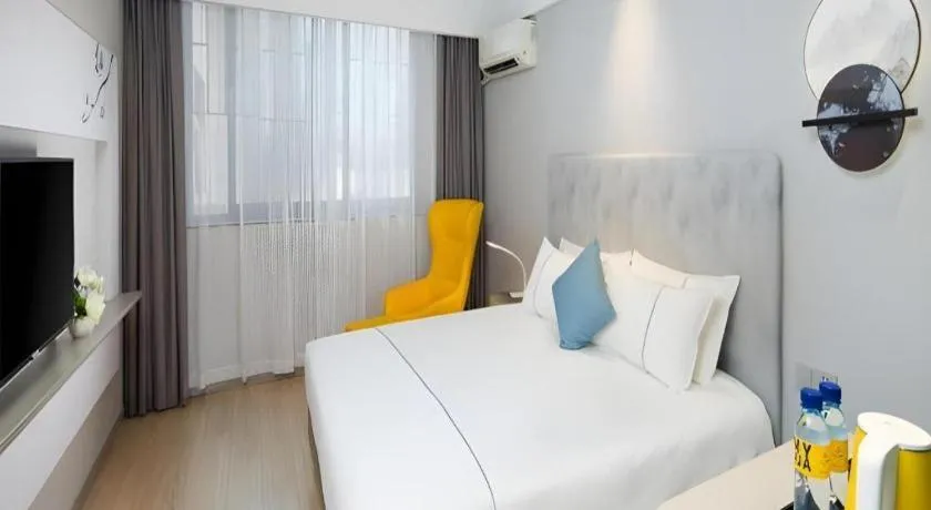 Bed in Magnotel Hotel Shanghai Jinjiang Park Branch