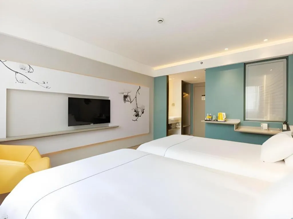 Bed in Magnotel Hotel Shanghai Jinjiang Park Branch