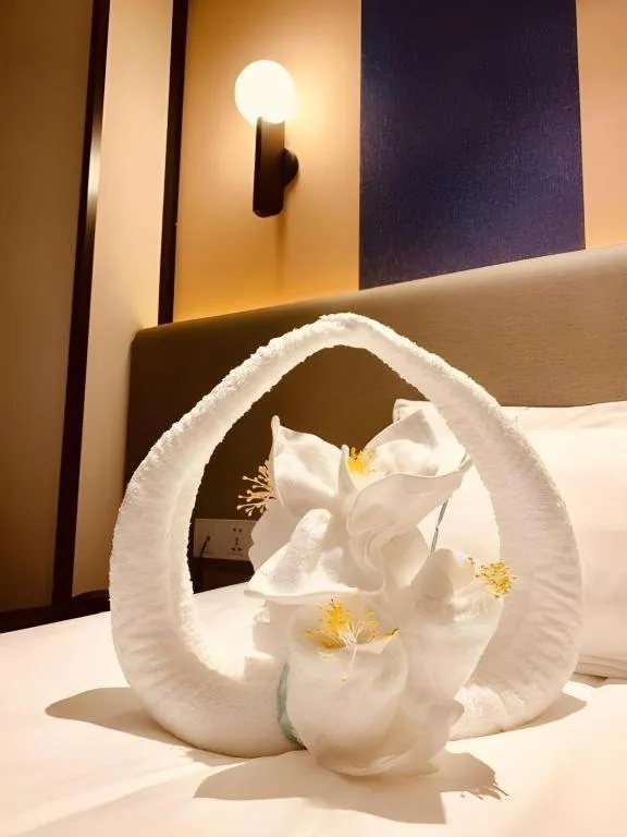 Bed in Magnotel Hotel Shanghai Jinjiang Park Branch