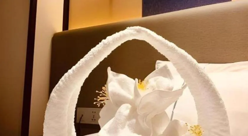 Bed in Magnotel Hotel Shanghai Jinjiang Park Branch