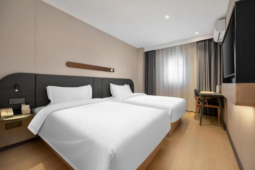 Bed in Jinjiang Inn Beijing Capital International Airport New Expo Metro Station